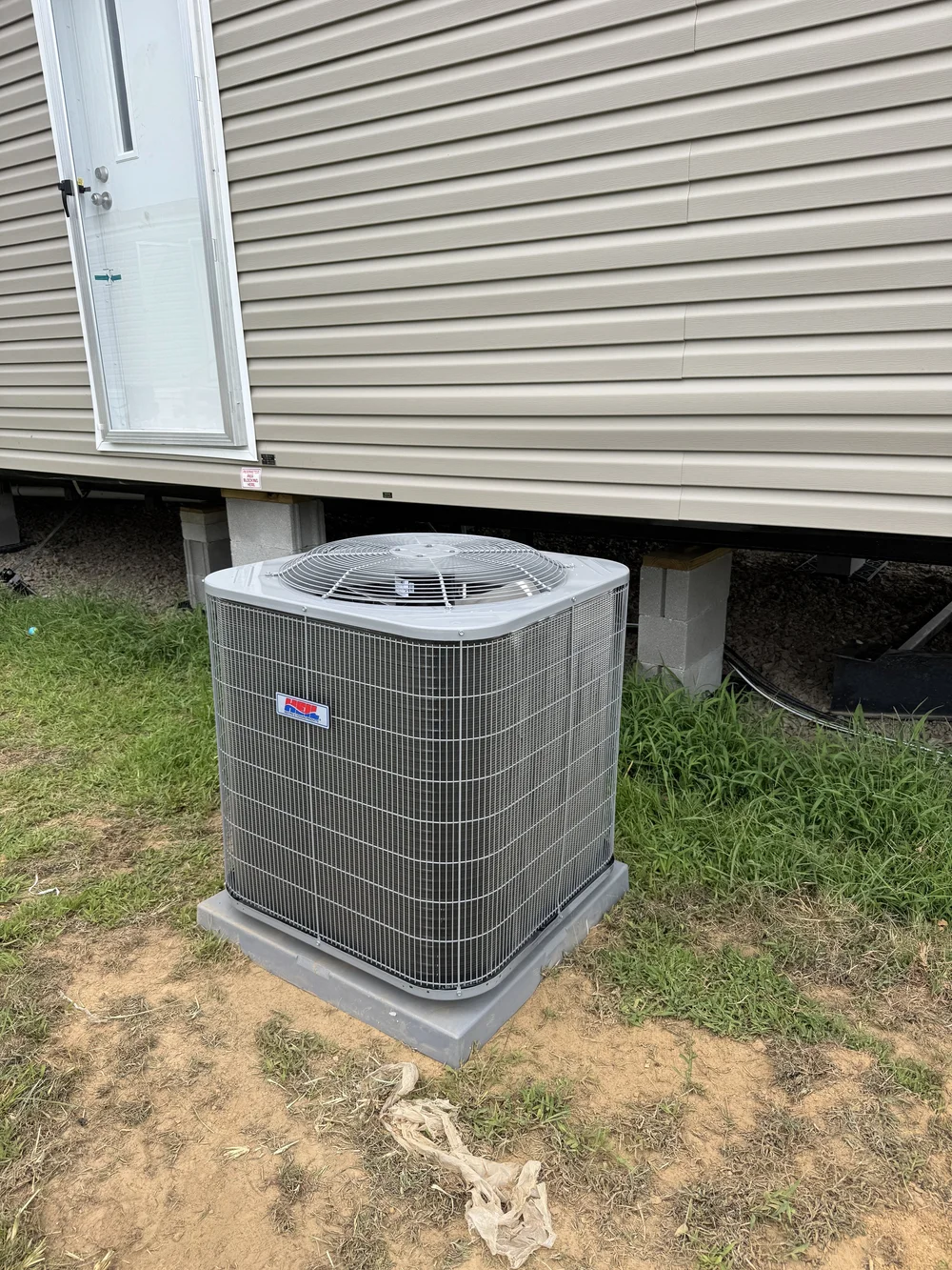 New AC condenser installed by Clark HVAC at a mobile home near Sallisaw, OK