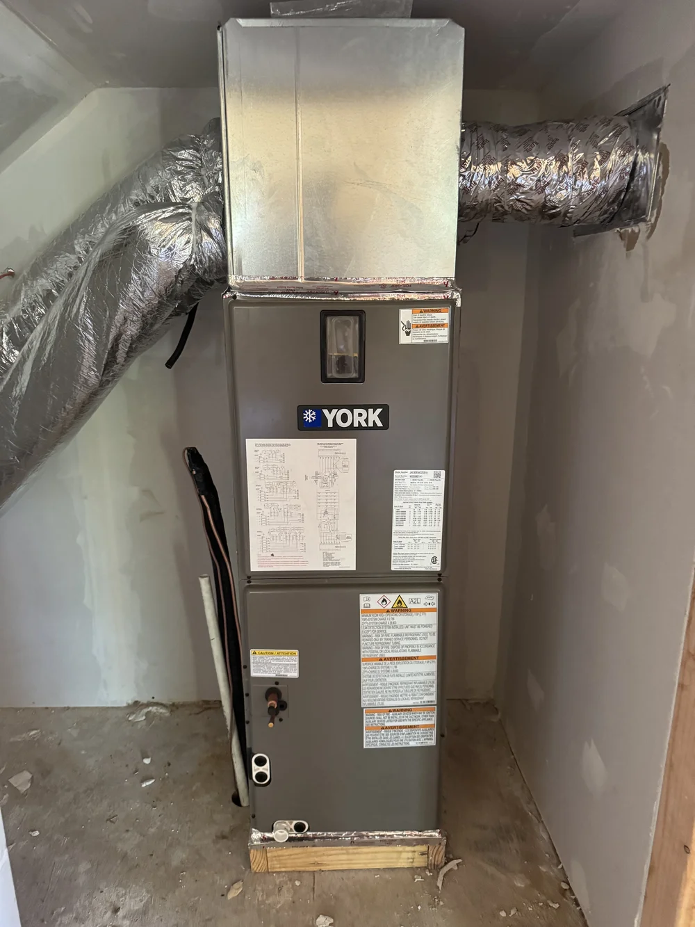 York air handler and new ductwork installed by Clark HVAC at a new-construction home near Spiro, OK