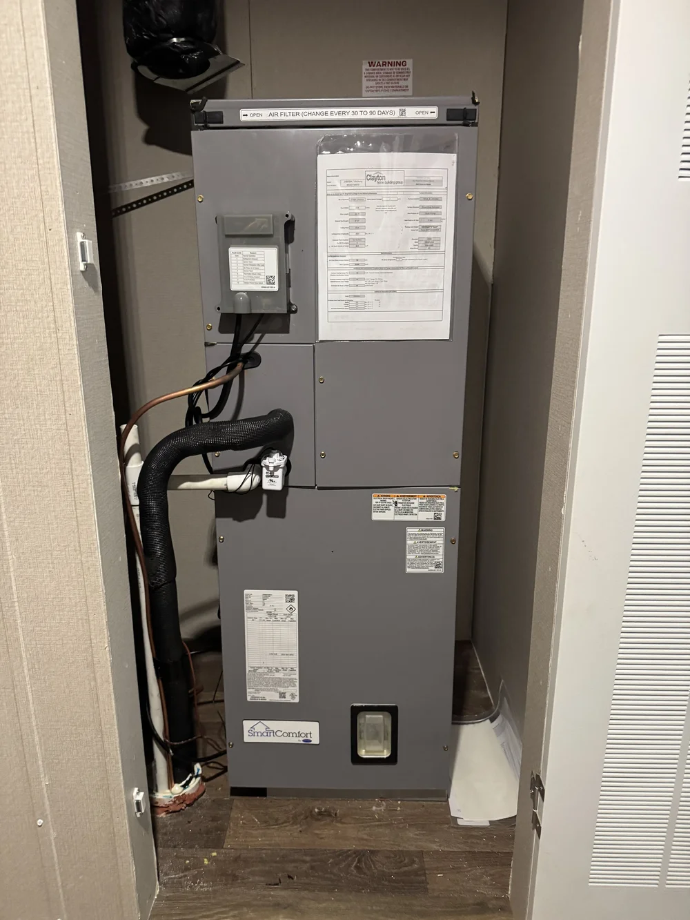 Air handler installed in a hall closet by Clark HVAC at a home near Sallisaw, OK