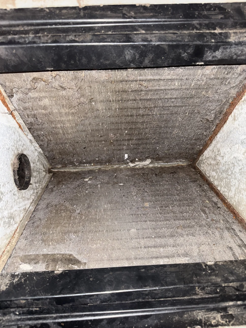 Dirt-packed condenser coil found on a Clark HVAC maintenance call in Poteau, OK