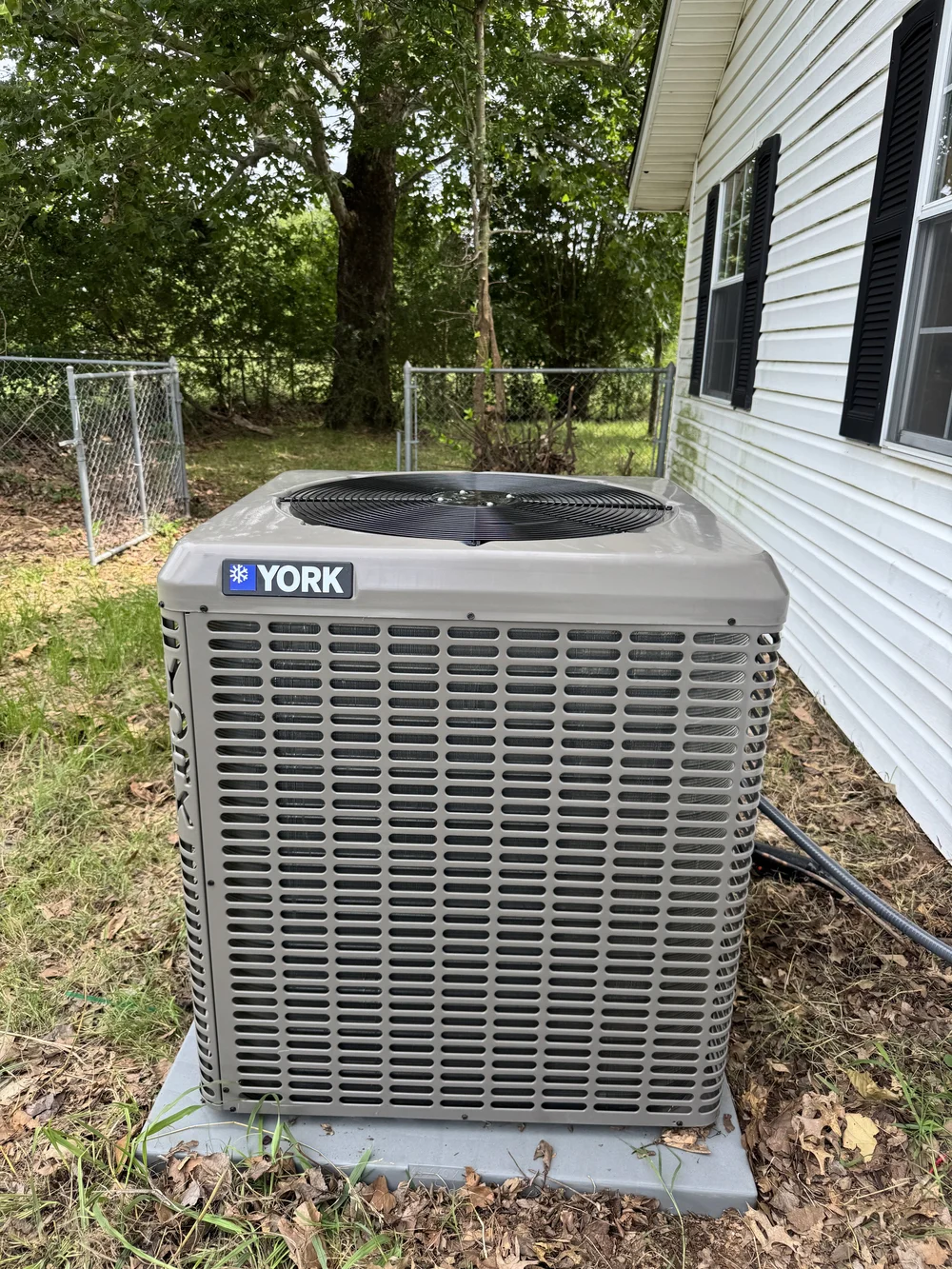 New York AC condenser installed by Clark HVAC at a mobile home near Keota, OK