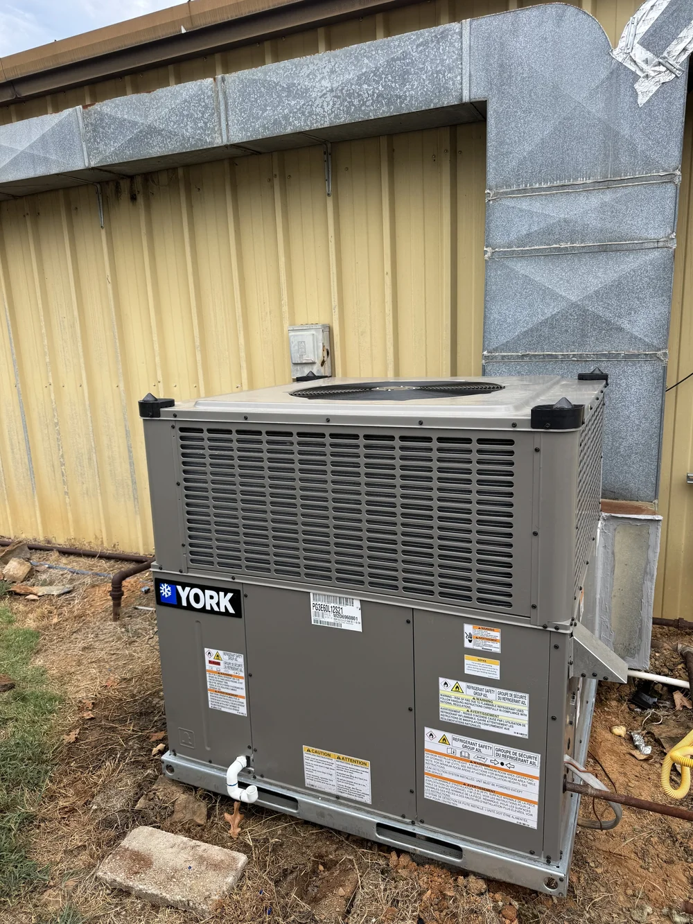 York package unit installed by Clark HVAC at a metal building near Spiro, OK