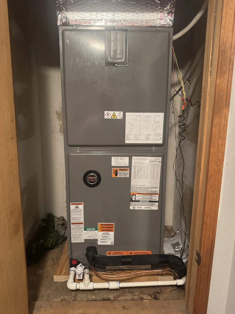 Closet air handler serviced by Clark HVAC at a home in Spiro, OK