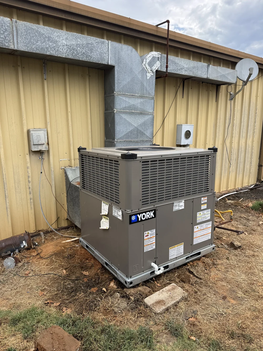 York package unit installed by Clark HVAC at a metal building near Spiro, OK