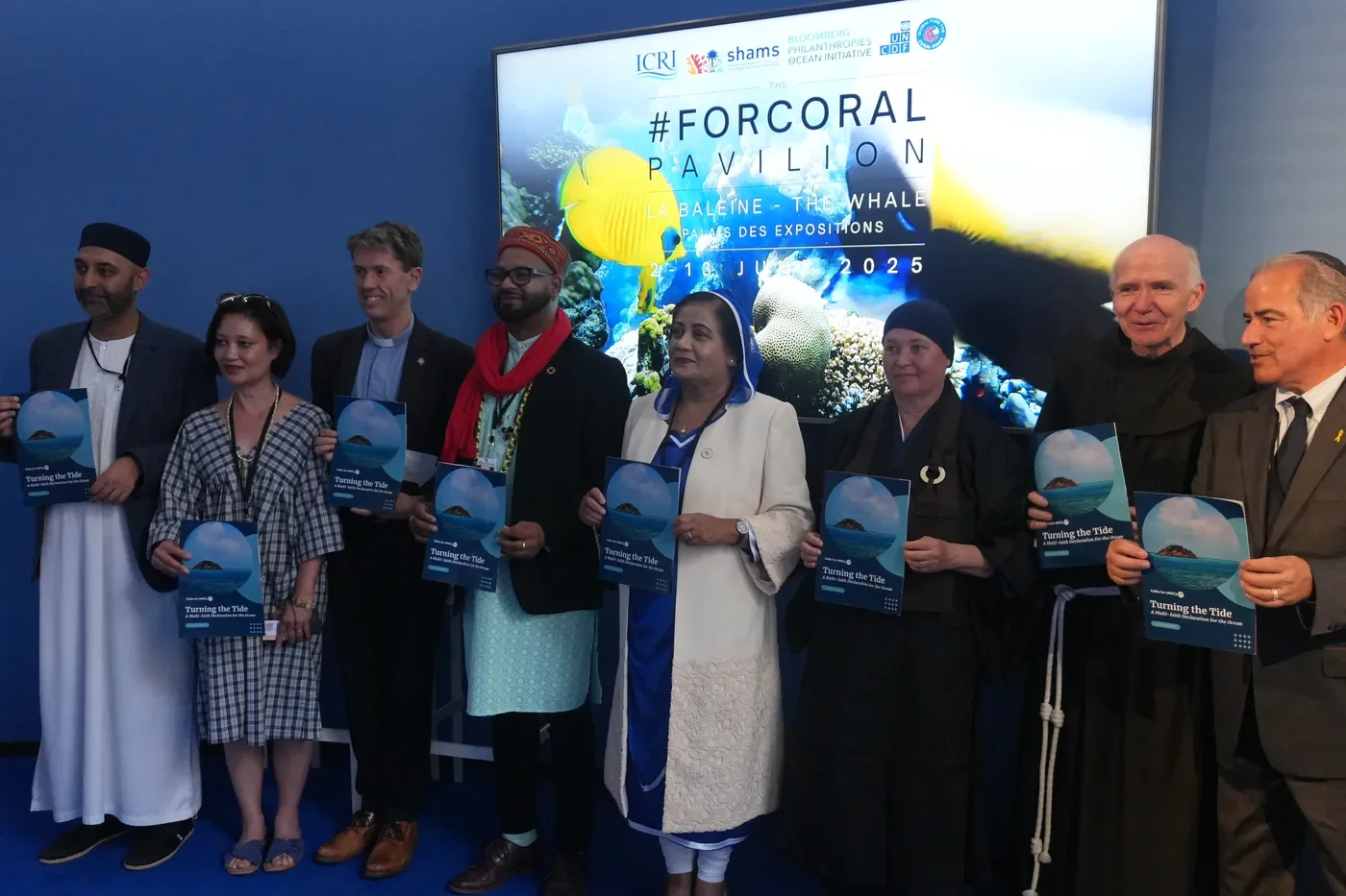 Faith leaders and signatories hold copies of Turning the Tide at its launch at the UN Ocean Conference in Nice.