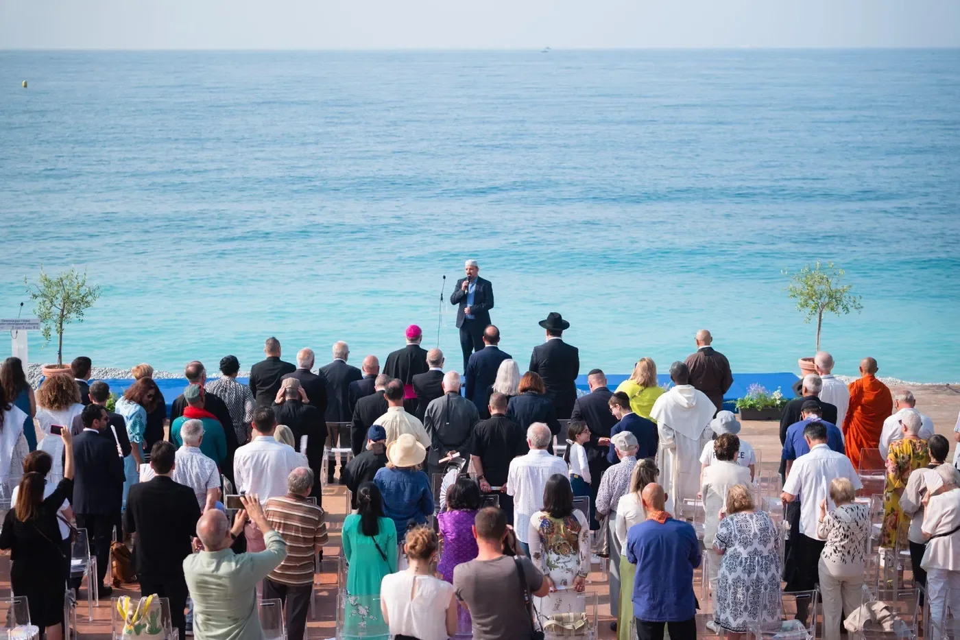 Faith leaders and delegates gather on the beach in Nice for the launch of Turning the Tide.