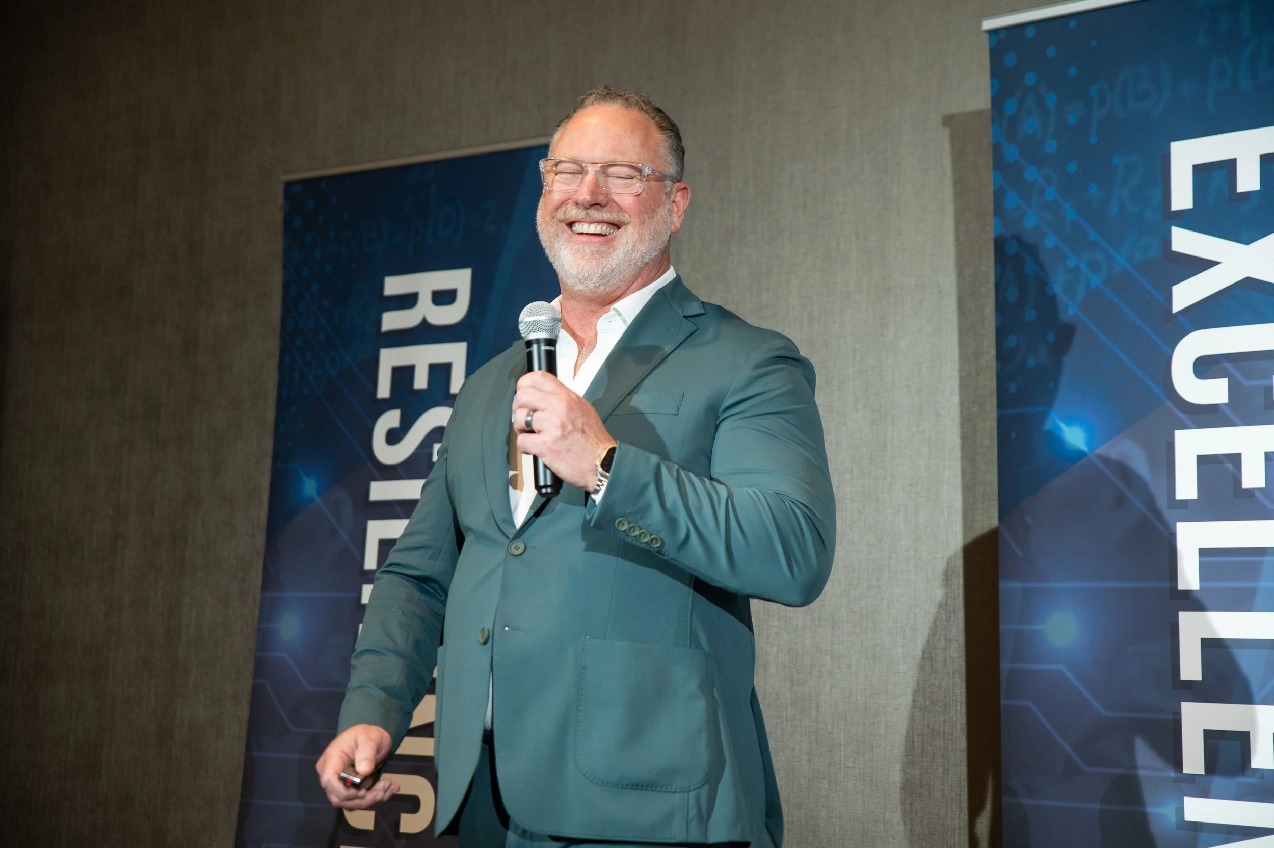 Scott Reib speaking on stage