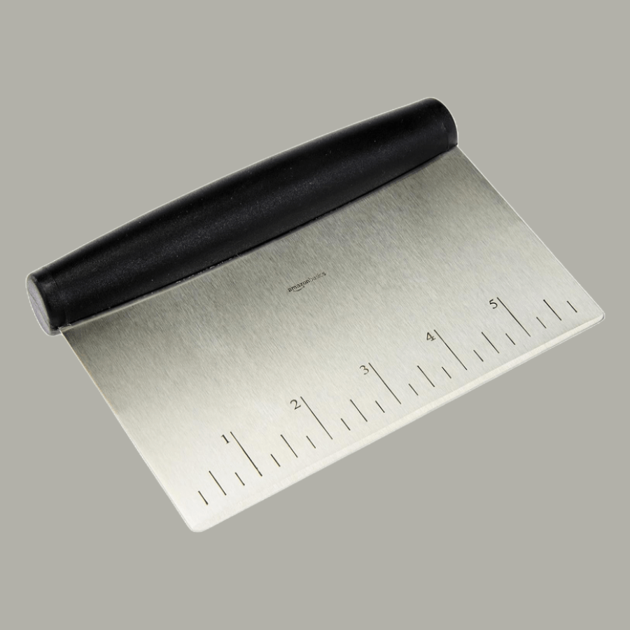 A steel dough scraper with a plastic handle