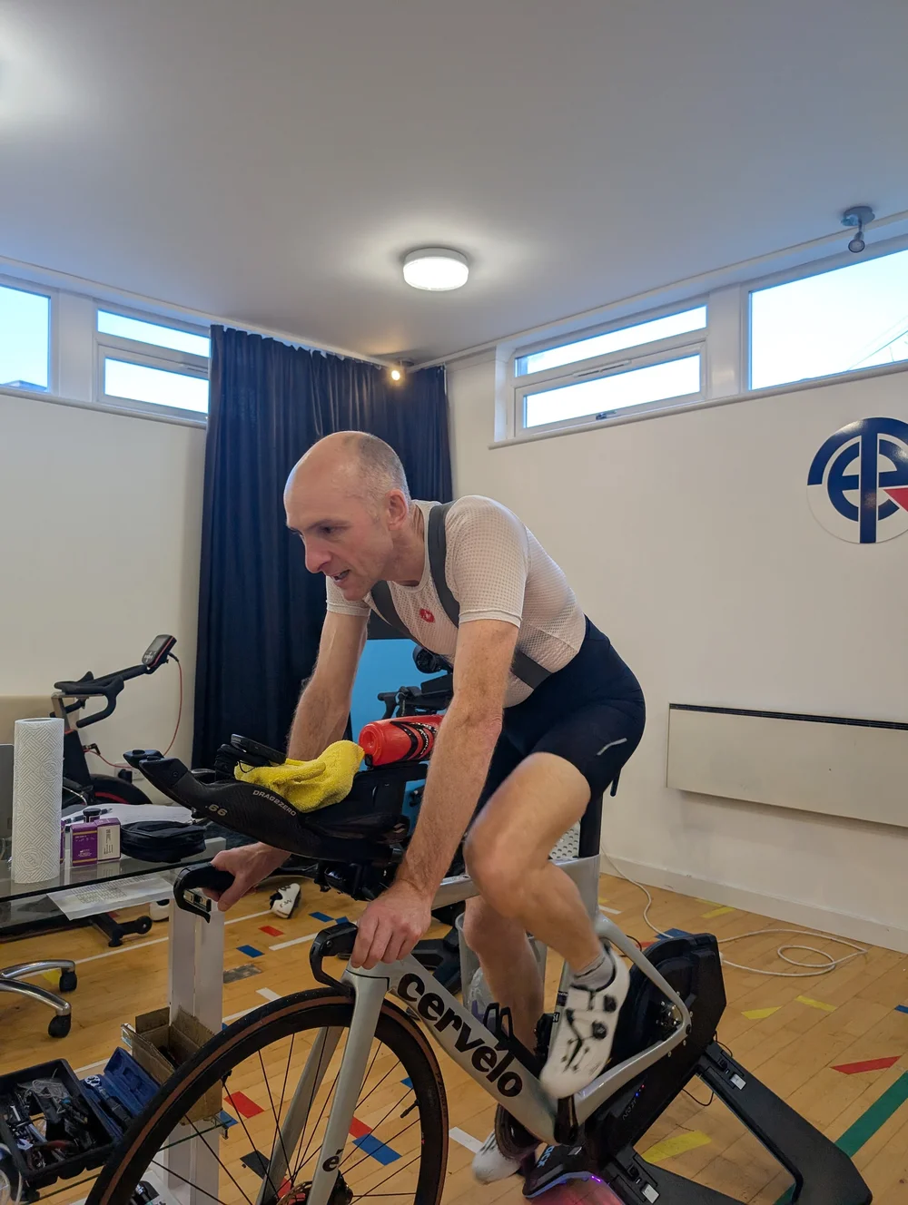 Triathlete testing on their own TT bike on a smart trainer in the Total Endurance lab