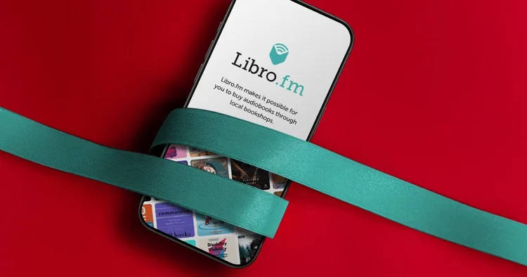 Libro.fm audiobook gift on a phone wrapped in ribbon