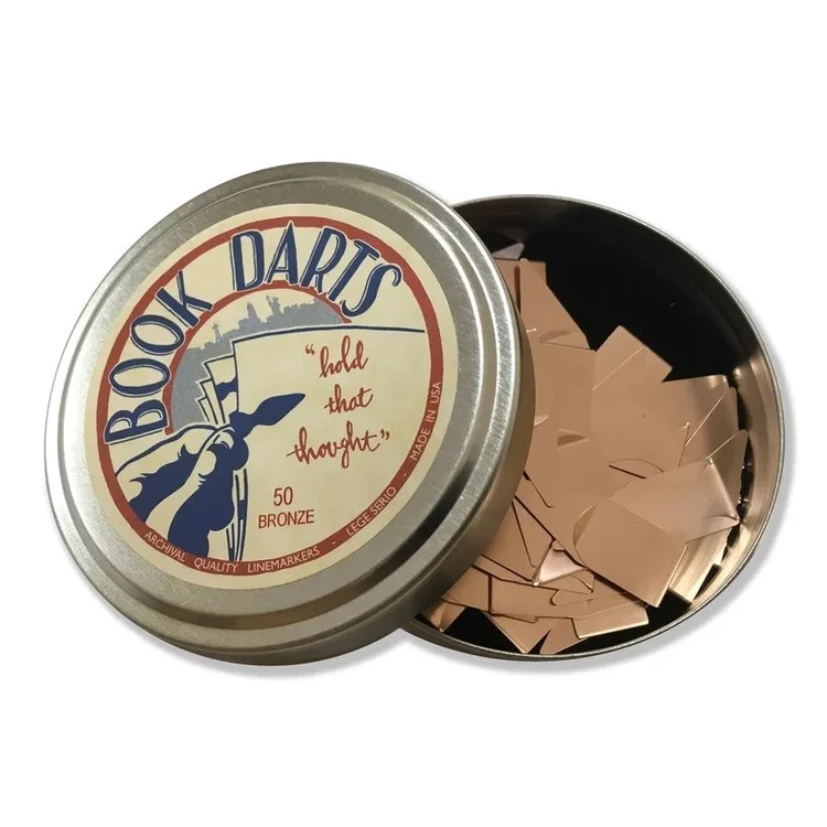 A tin of 50 bronze Book Darts line markers