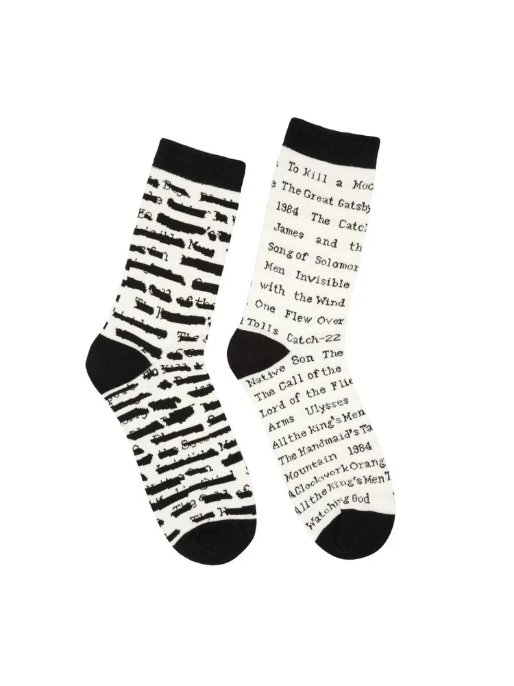 Out of Print Banned Books socks, a mismatched pair printed with text and censor bars