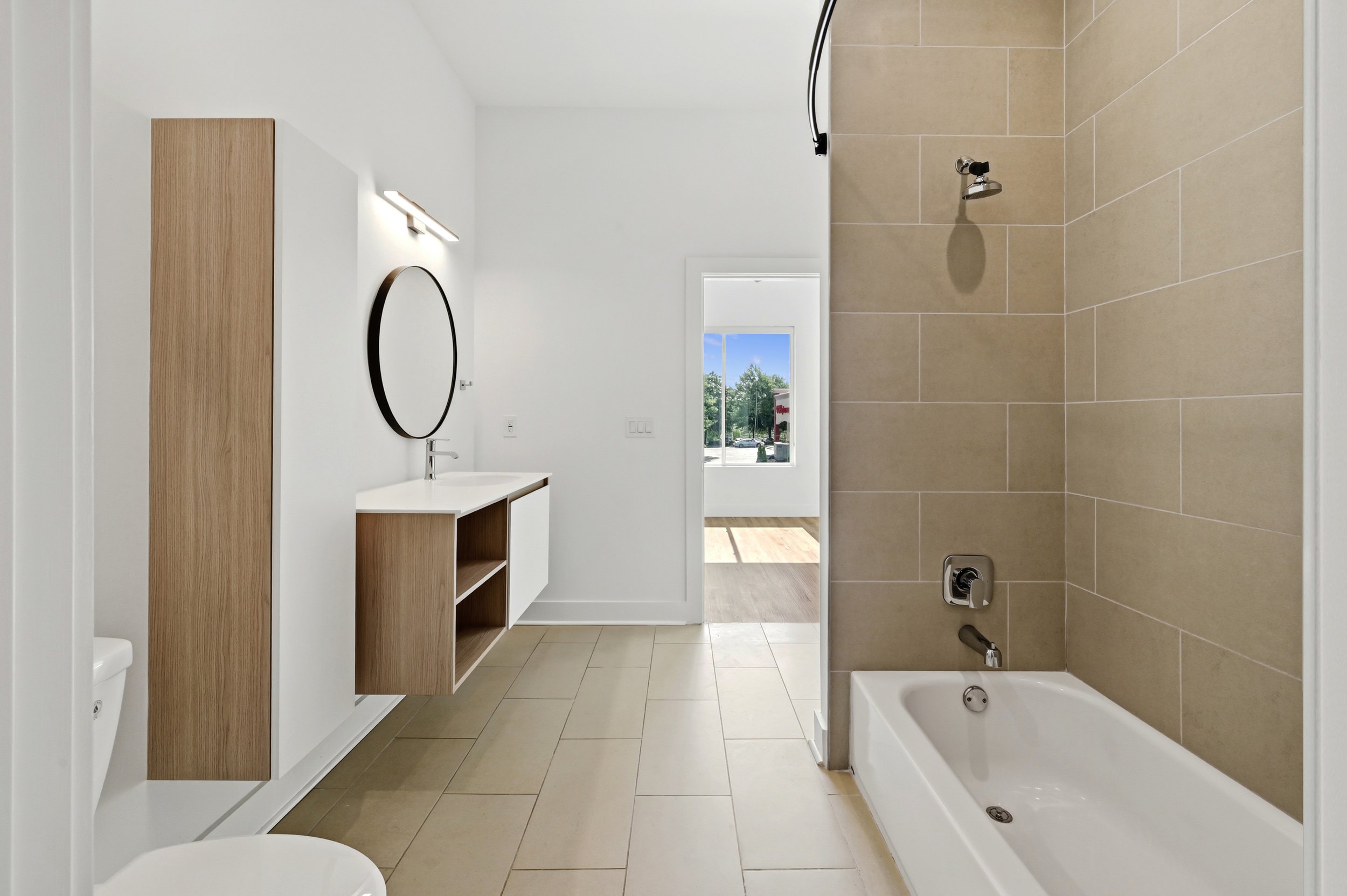 Updated secondary bathroom with modern tile finishes at Moreland Walk #202