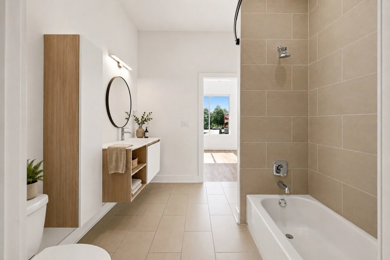 Virtually staged secondary bathroom with tub at Moreland Walk #202
