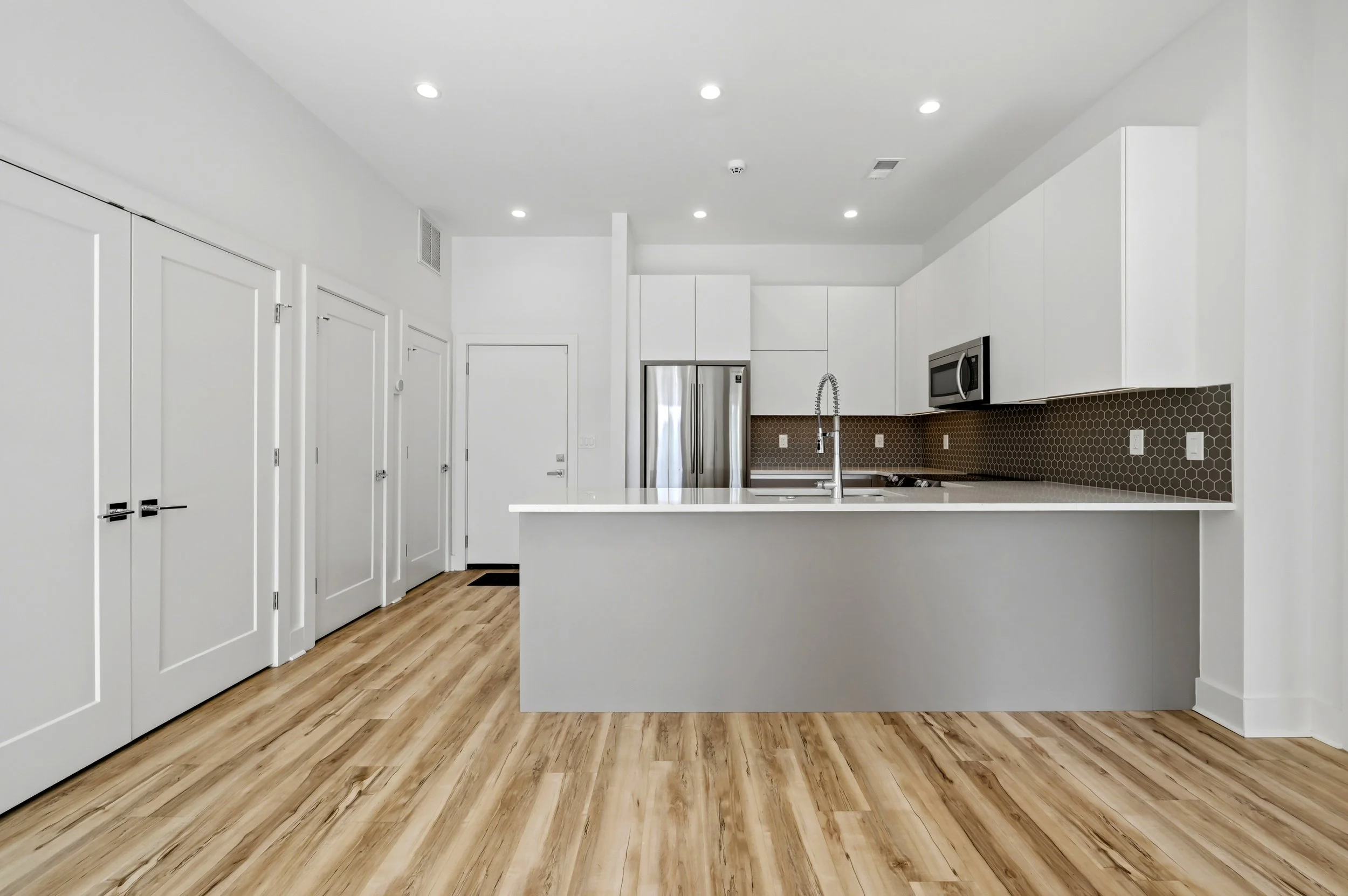 Light-filled living room with open floor plan at Moreland Walk #202