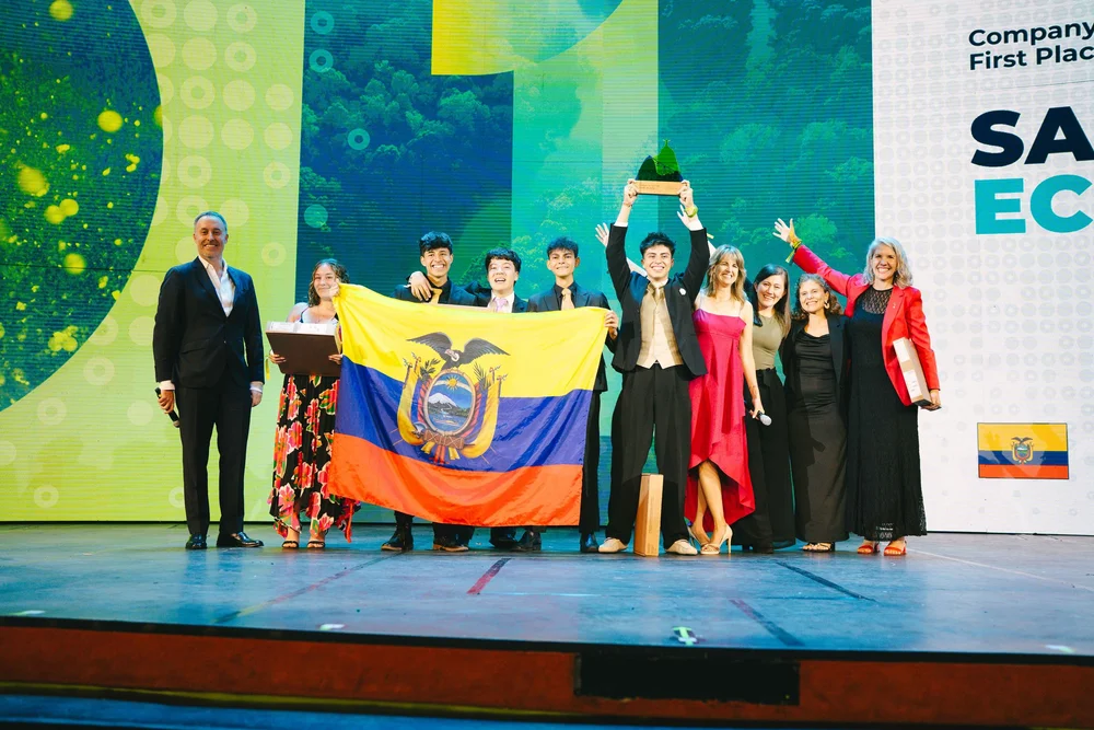 Student entrepreneurs celebrating with the Ecuadorian flag