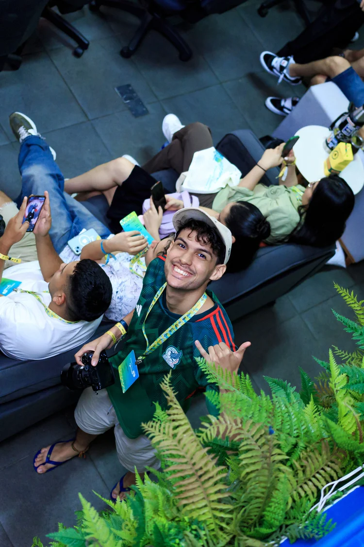 An alum taking a selfie with friends during a session