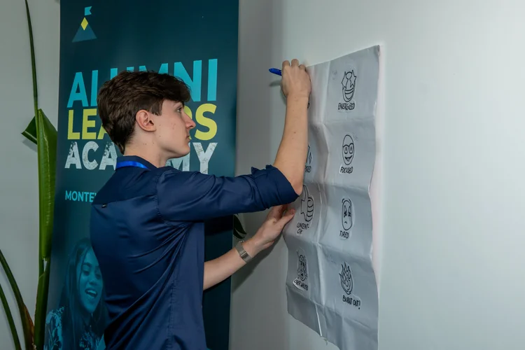 An alum mapping ideas on a whiteboard at Alumni Leaders Academy