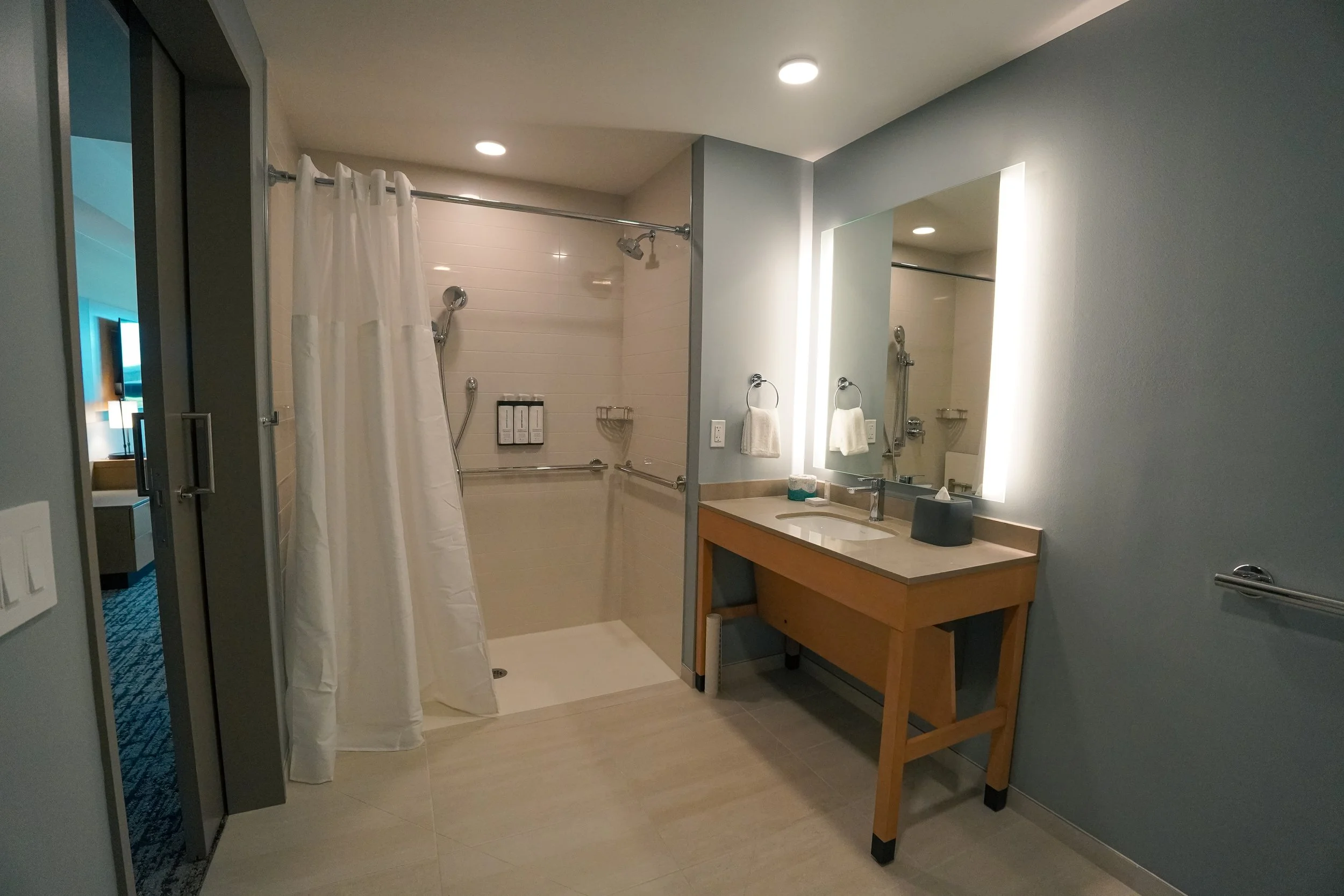 Living and sleeping area inside a Hyatt Hoʻopili guest room