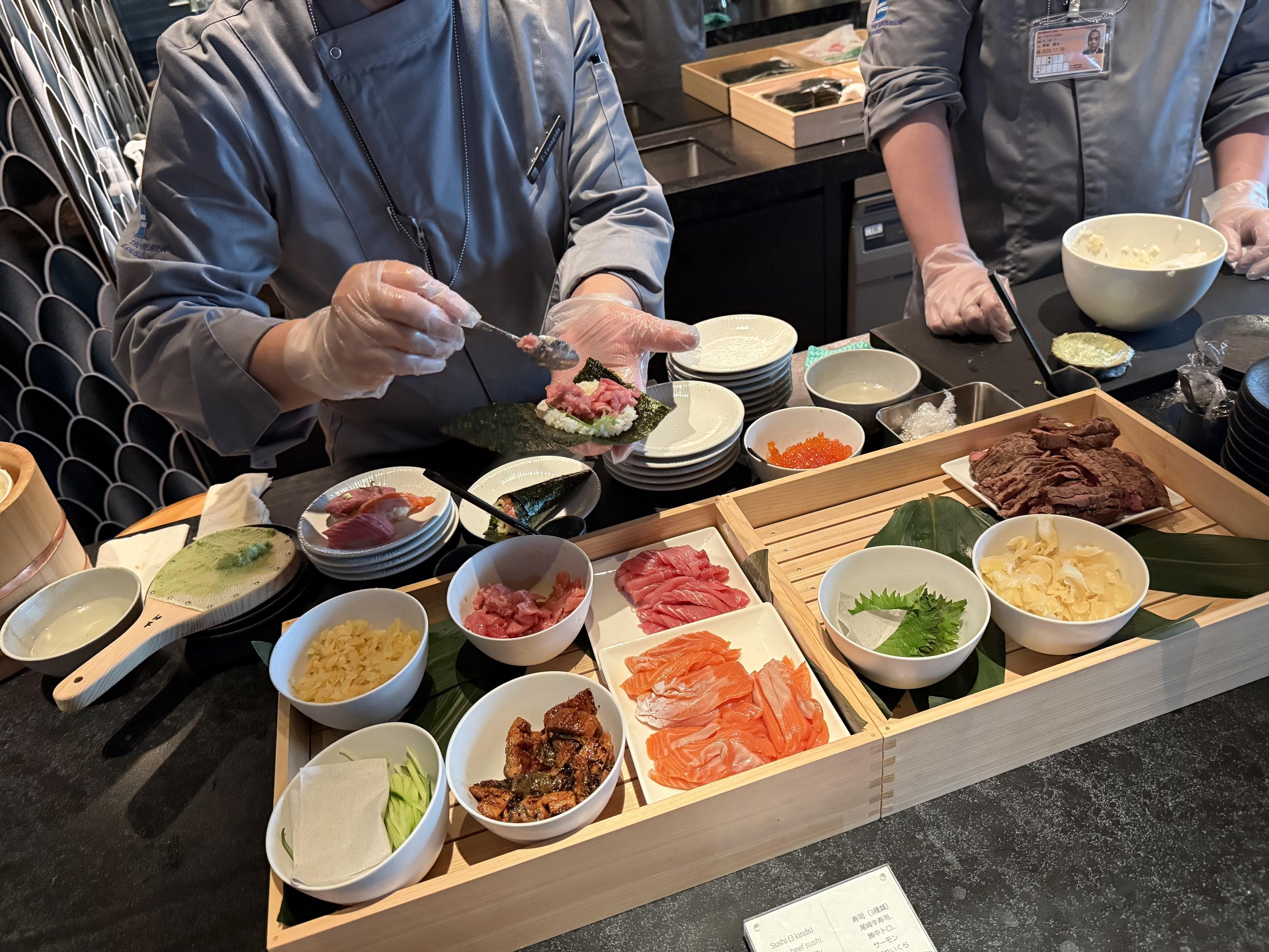 Food and seating inside the American Express Centurion Lounge at Tokyo Haneda Airport