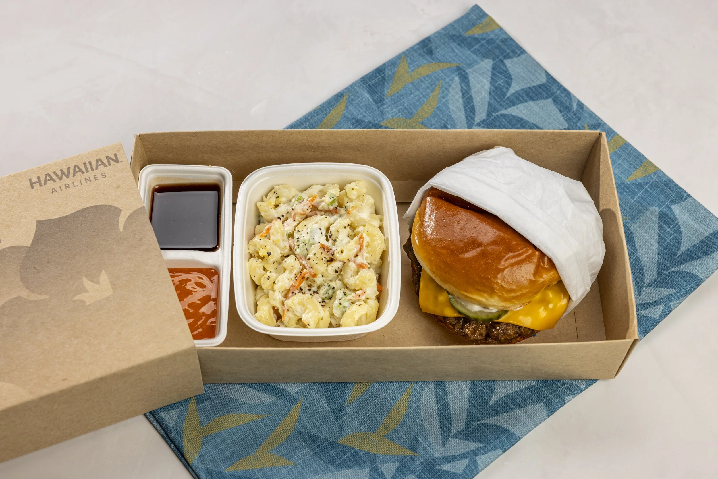 Teriyaki cheeseburger on a glazed bun with house-made pickles