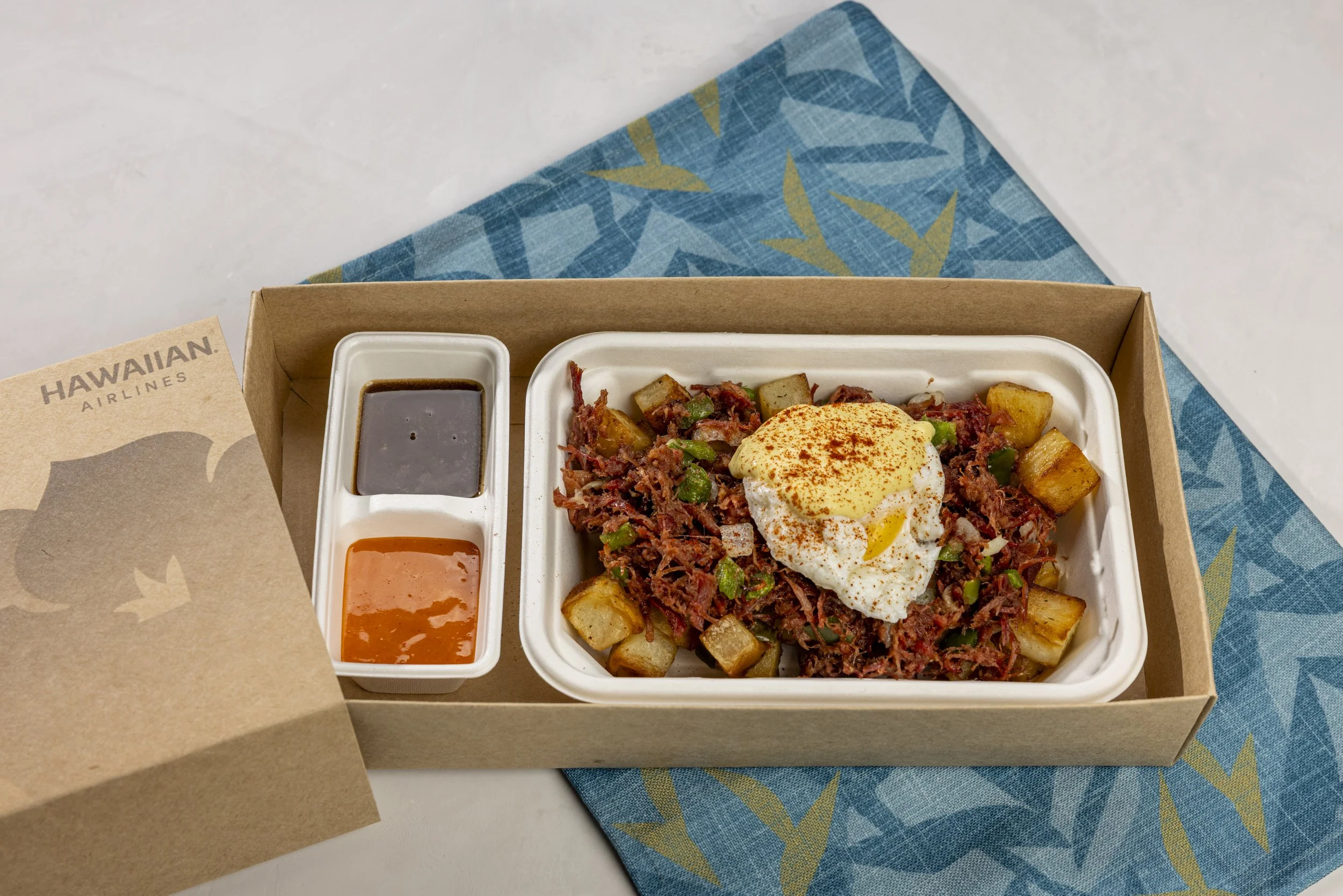Corned beef hash and eggs with hollandaise and roasted potatoes