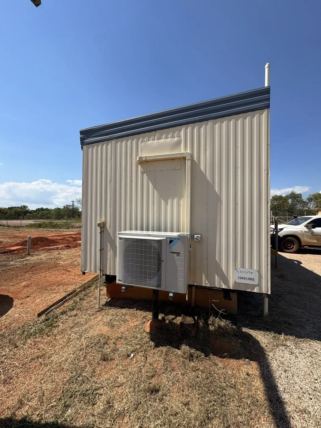 Condenser installed on an asset-numbered transportable building