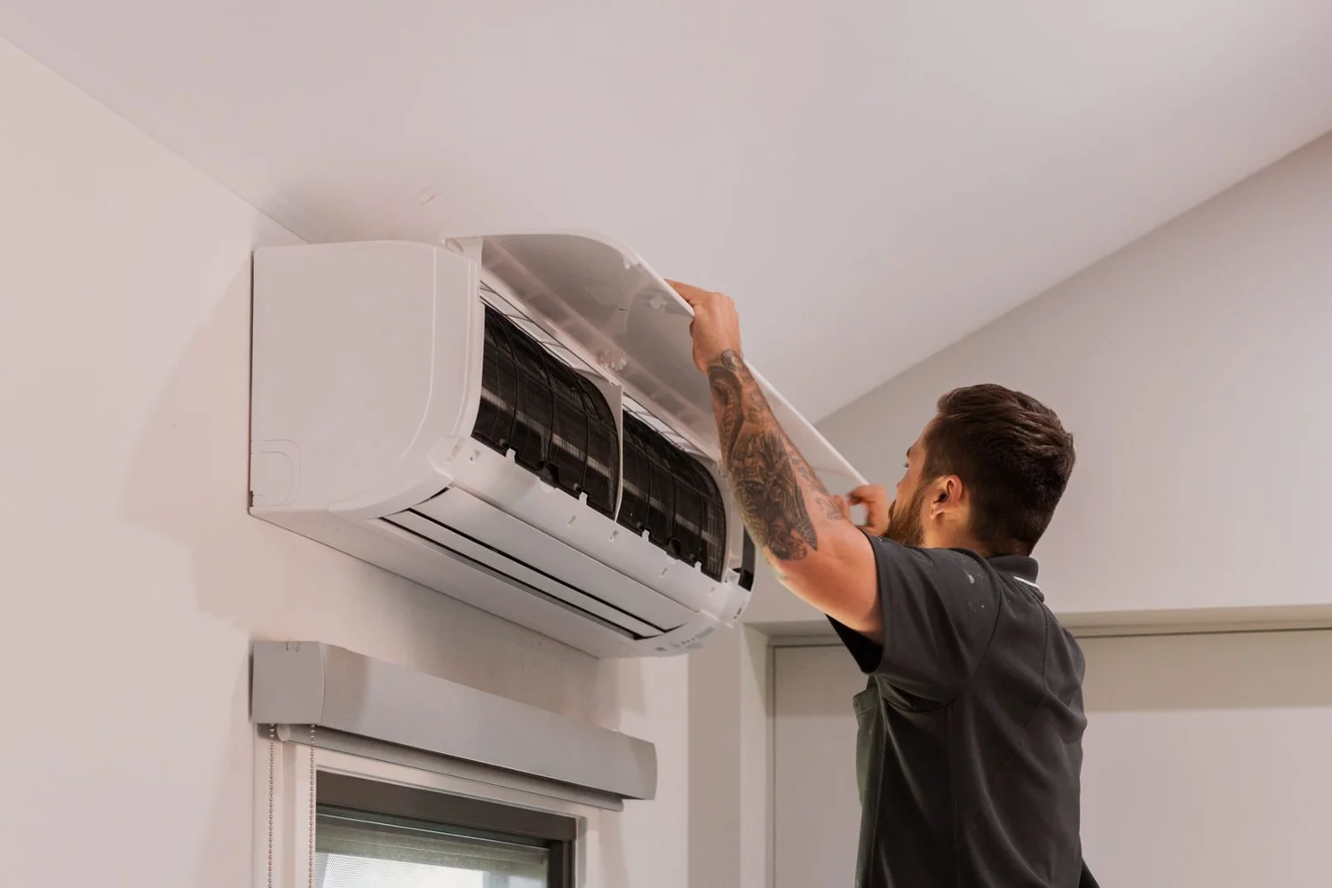 Technician servicing a split system