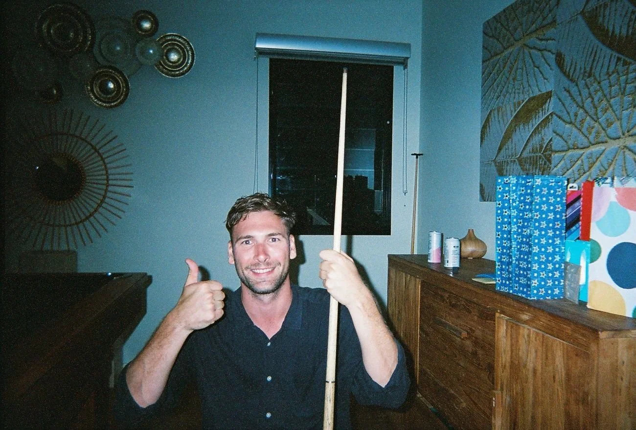 Thumbs up over a game of pool