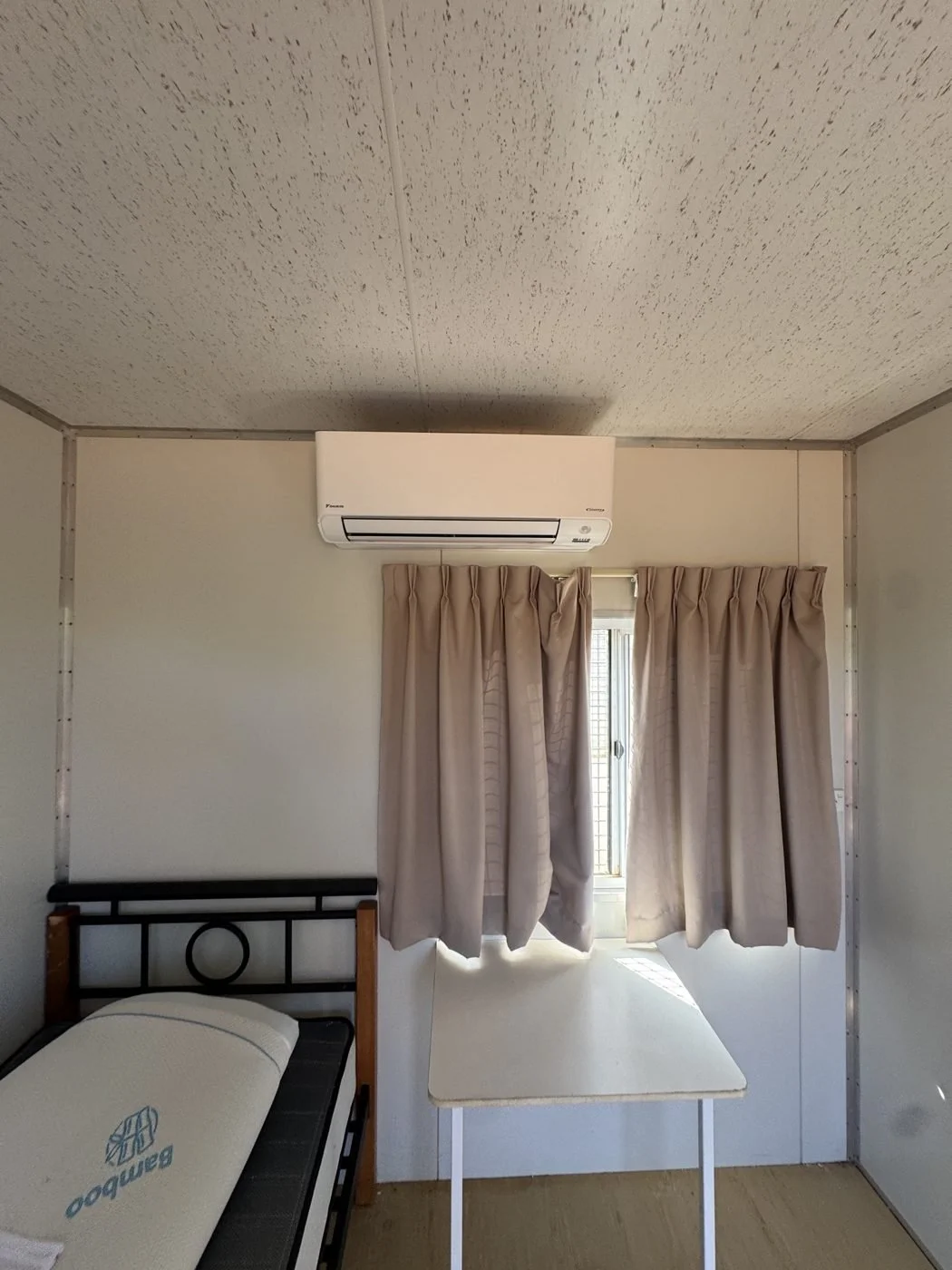 Split system installed in remote transportable accommodation