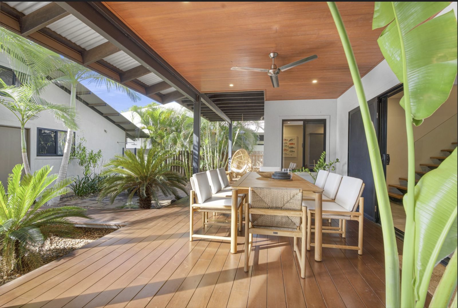 Outdoor deck with ceiling fan and recessed lighting