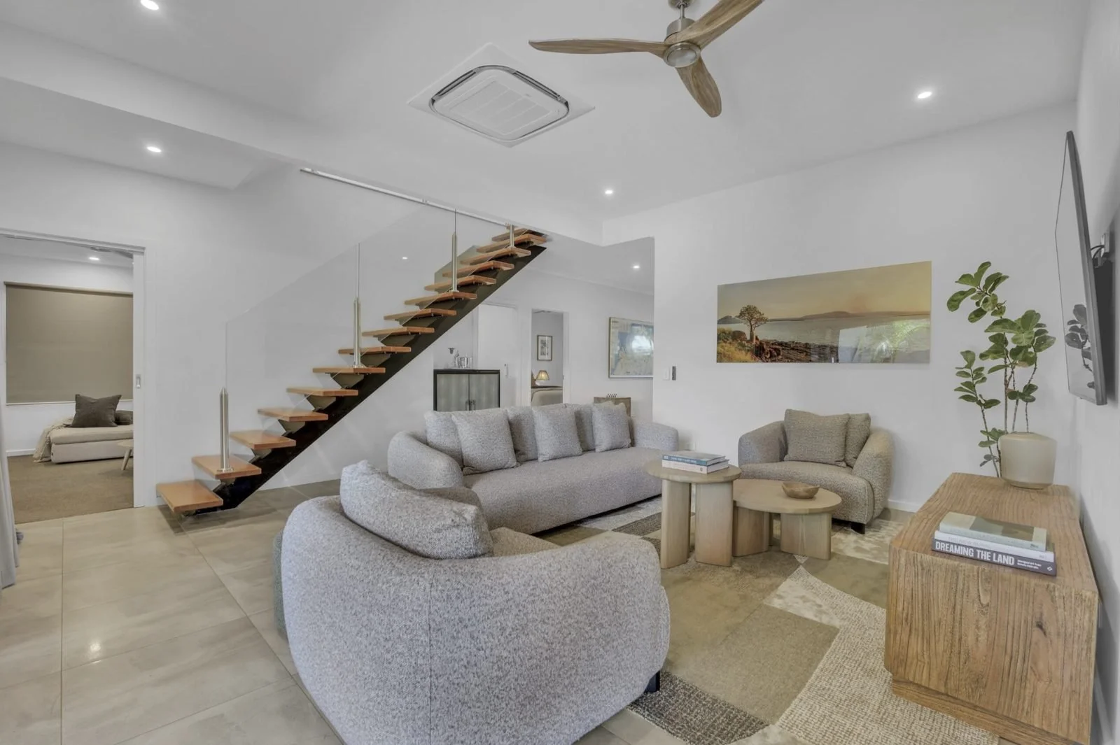 Living room with ceiling fan, downlights and cassette air conditioner