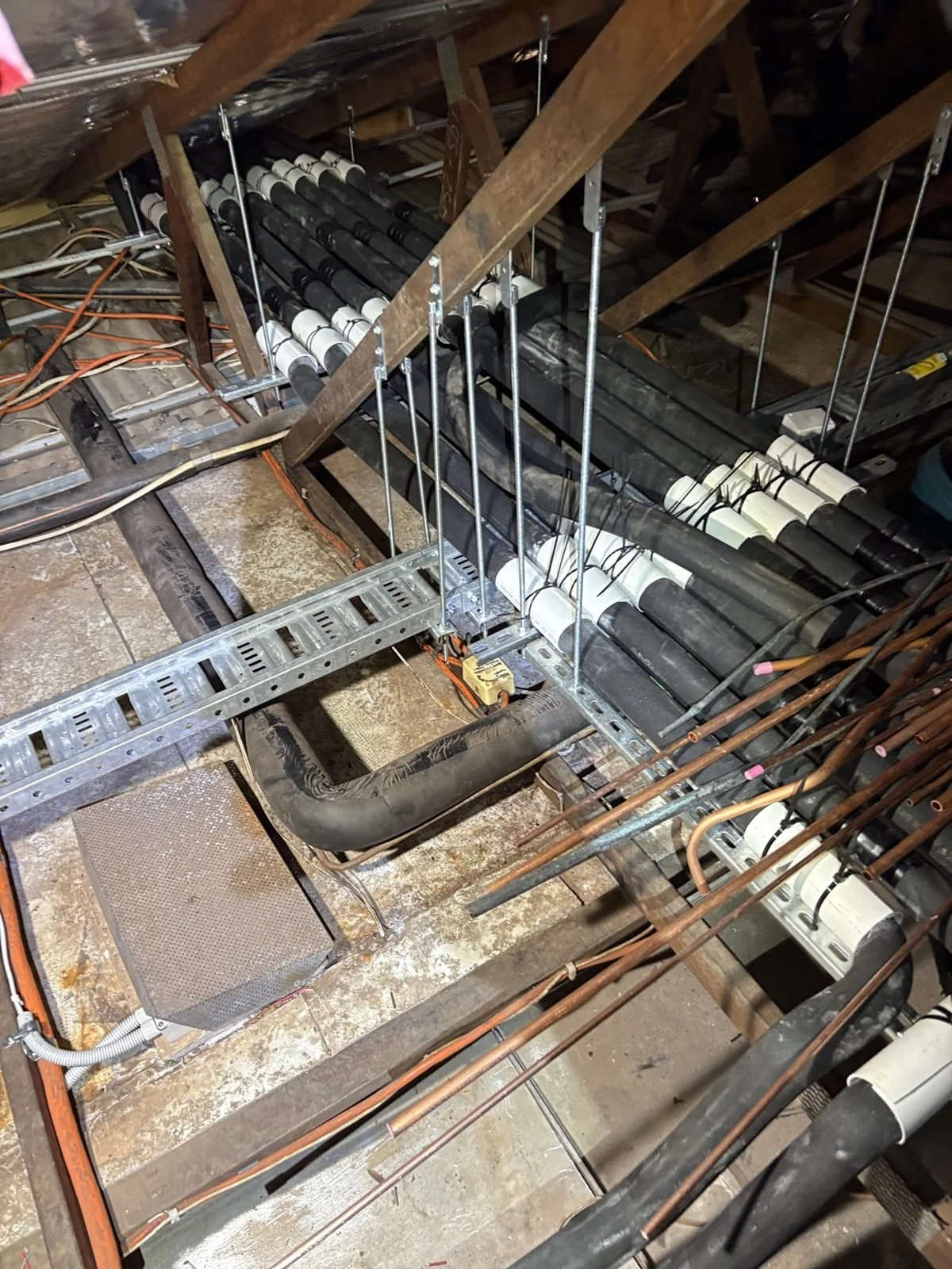 Refrigerant pipework neatly supported in a commercial roof space