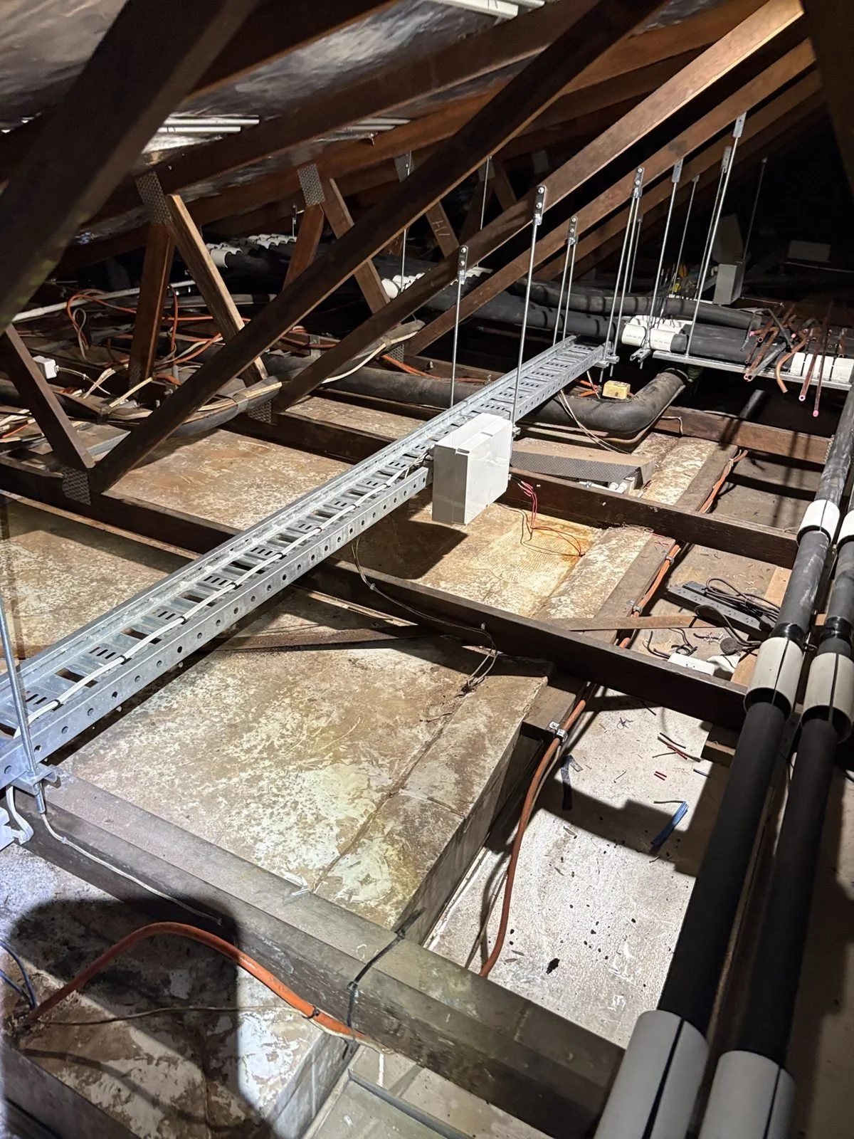 Cable tray installed in a commercial roof space