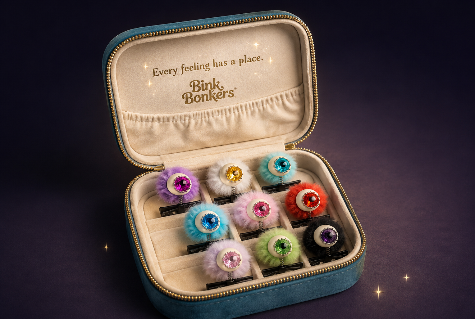 The Eye See You Emotion Clip-On collection presented in its keepsake travel case against a midnight backdrop