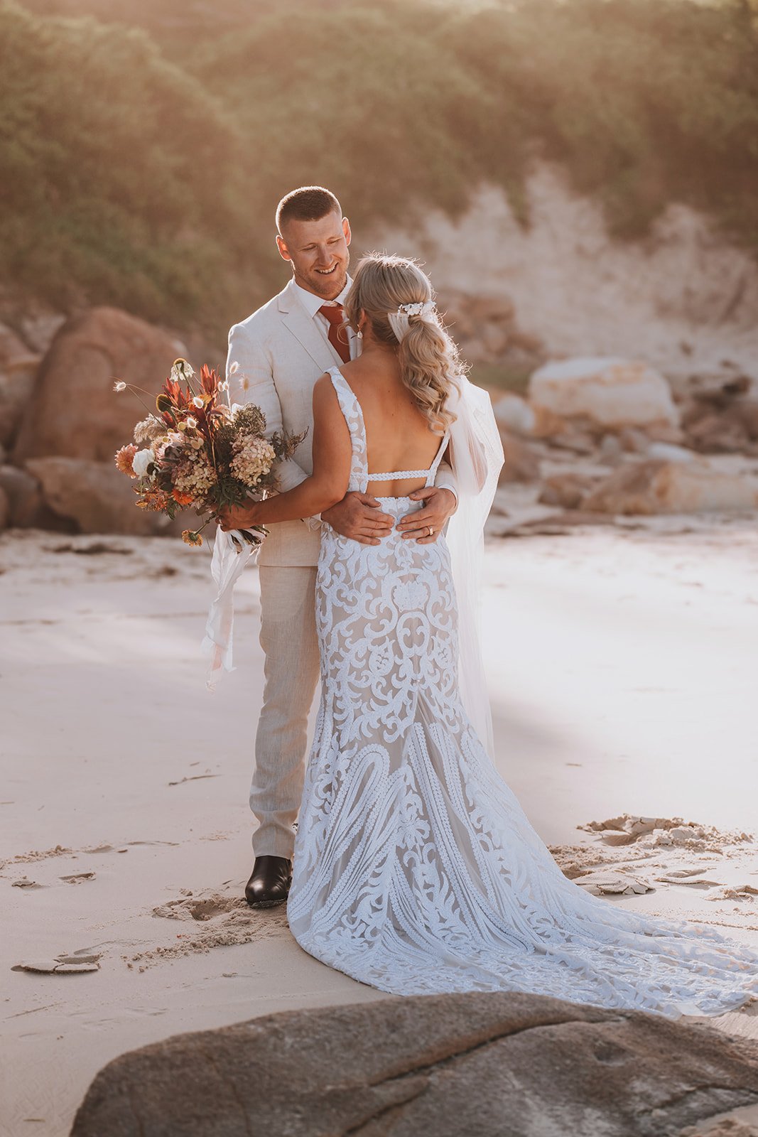 Relaxed bride and groom laughing at Shoal Bay Country Club wedding