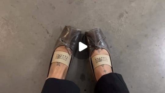 Feet in heels on a concrete floor