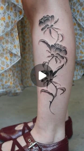 Flower tattoo running down a calf