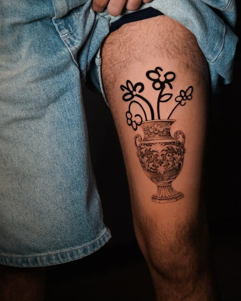Bad Bunny inspired vase of flowers tattooed on a thigh