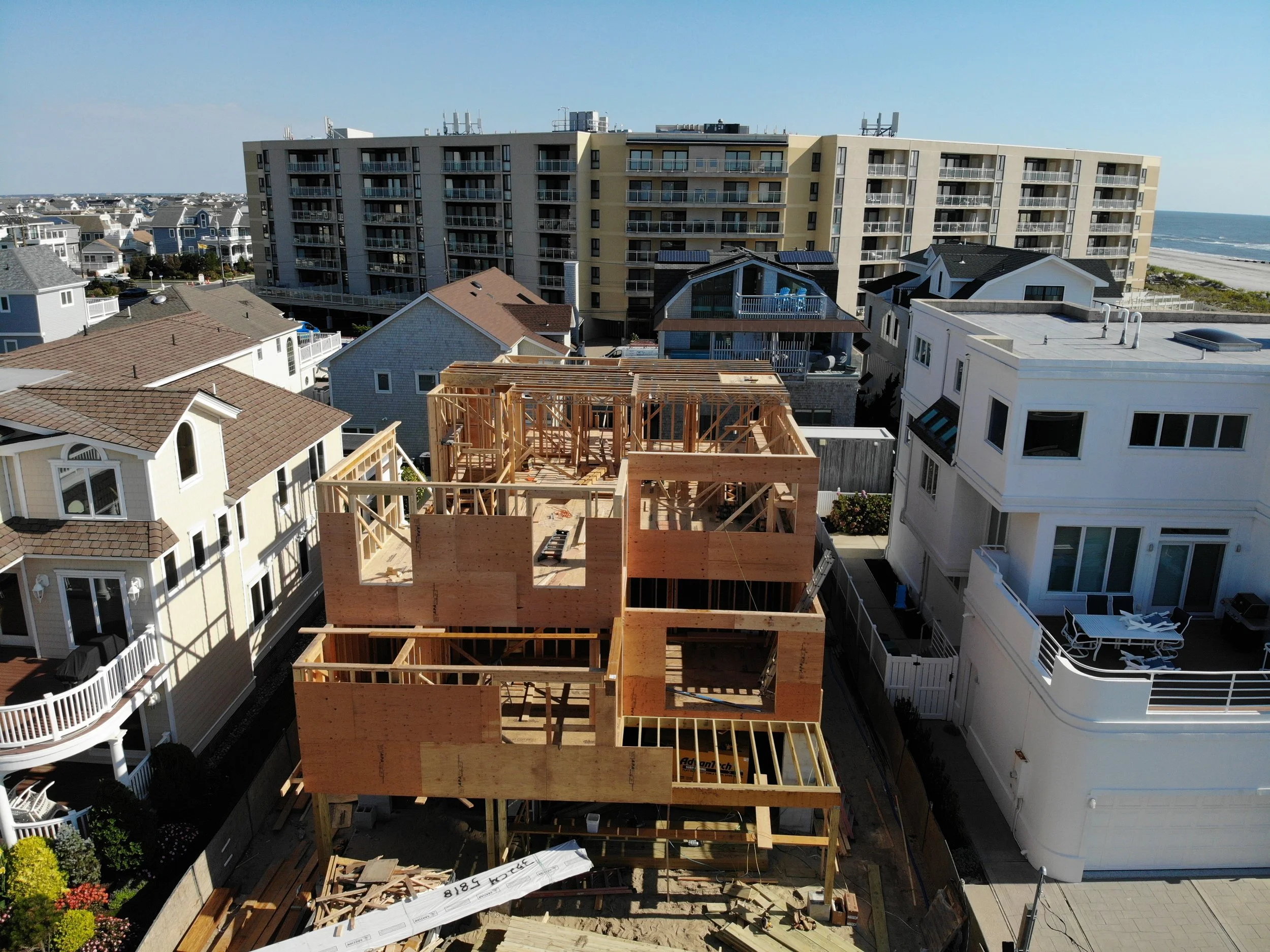 Drone view of a new custom home being framed near the beach in Longport, NJ