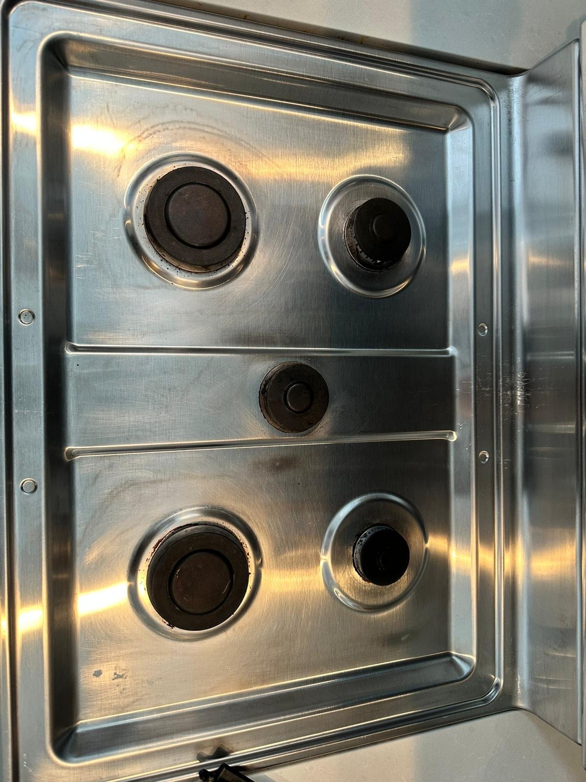 Clean stove burners after service