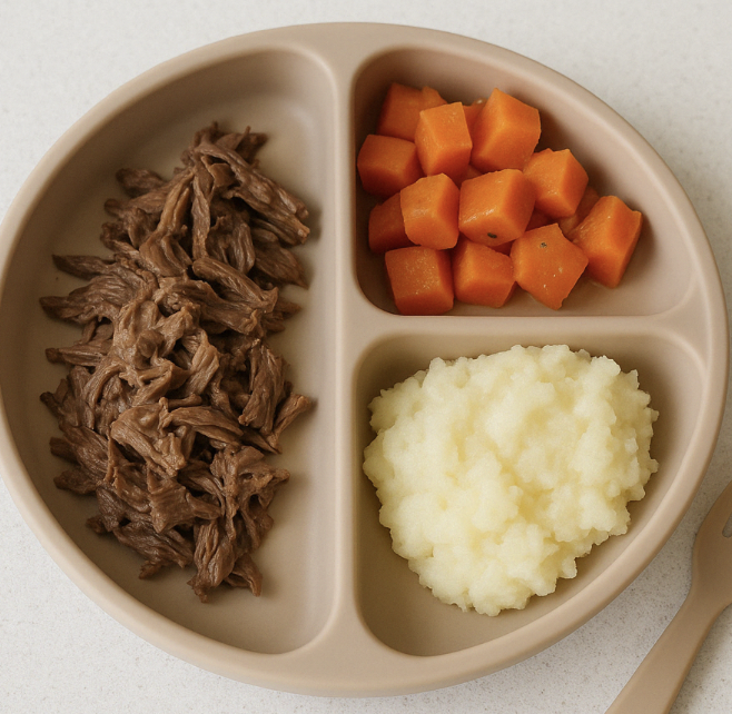 Pot roast with carrots and mashed potatoes on a plate