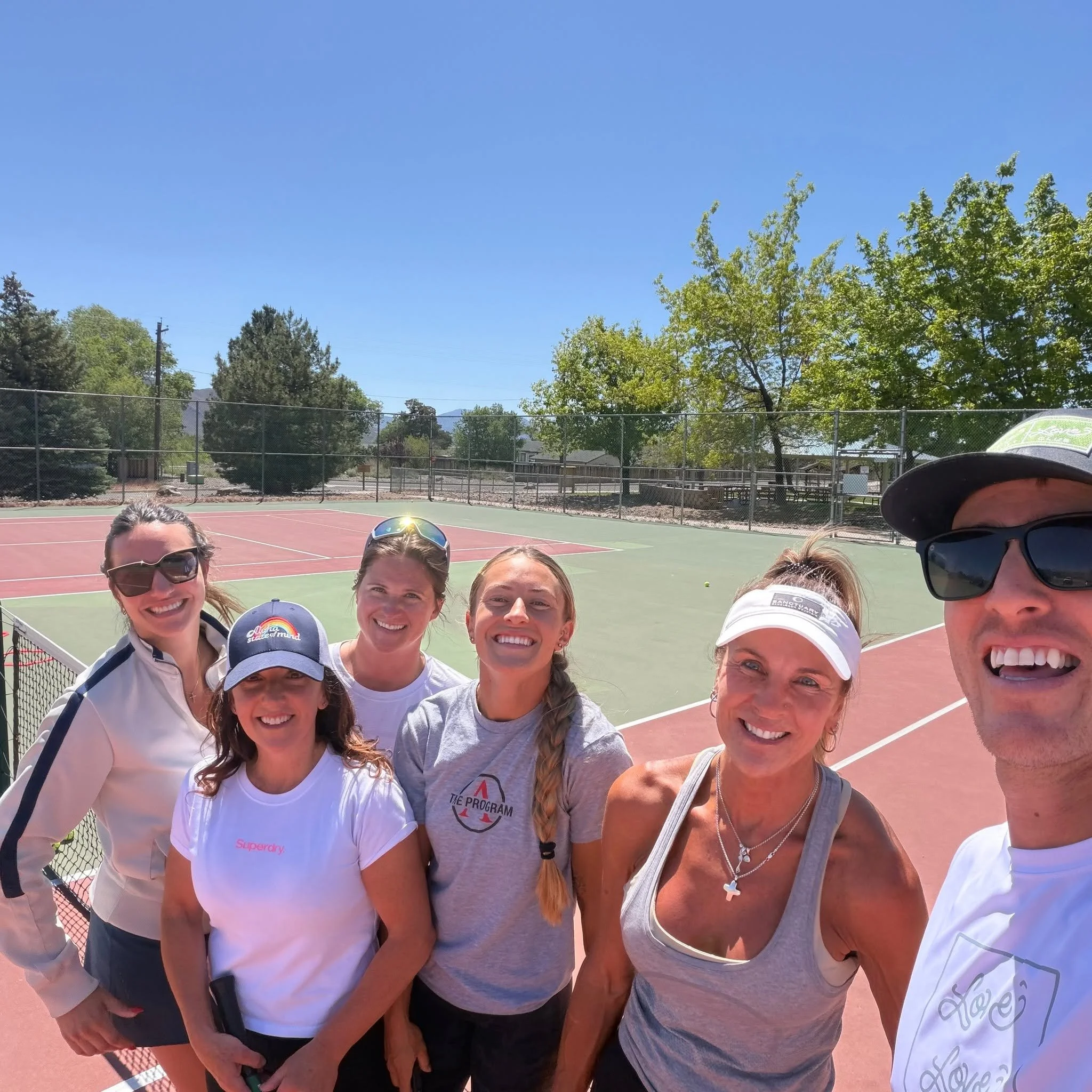 Adult tennis players at Love Love Racquet Club