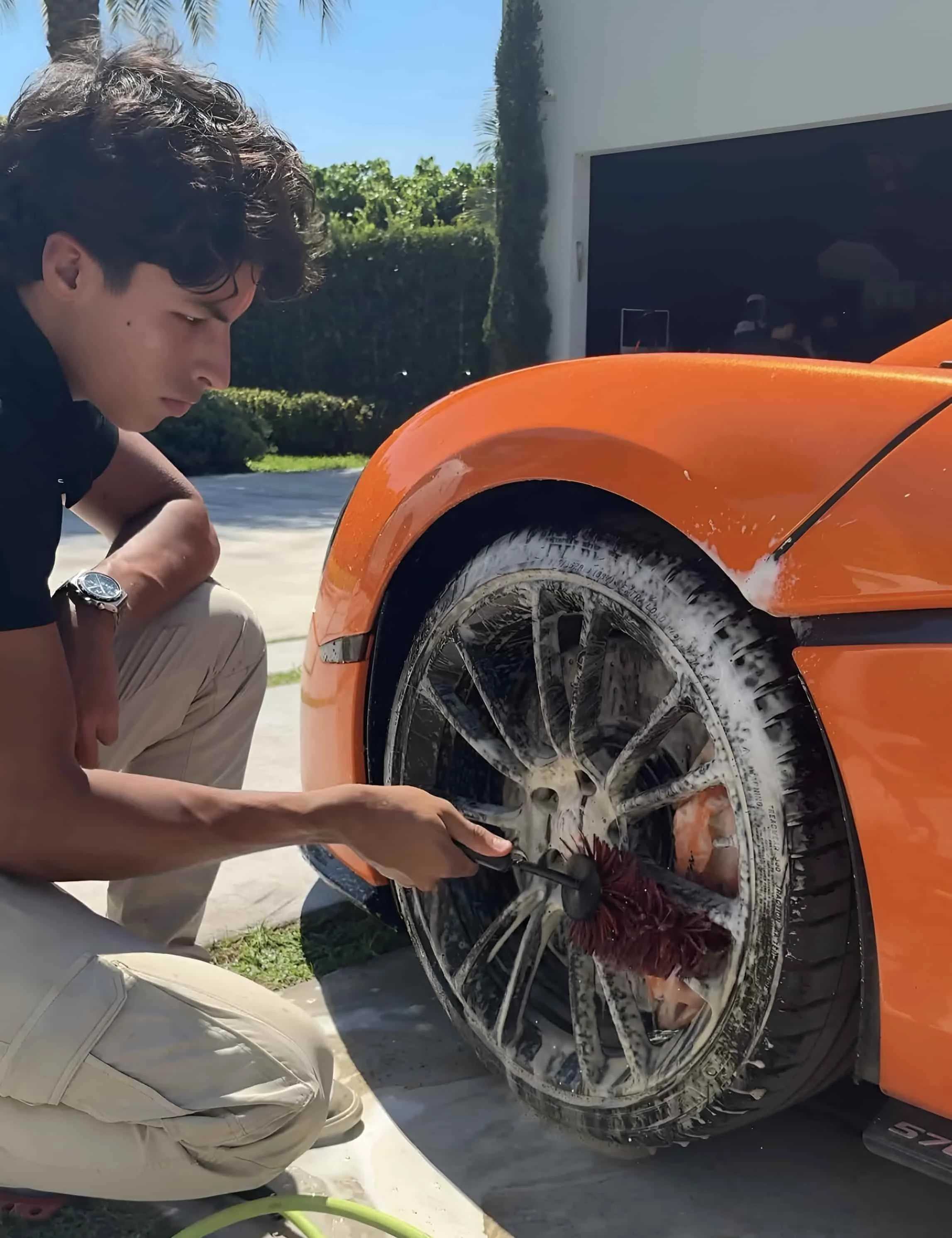 Ale's Mobile Detailing working on a luxury vehicle