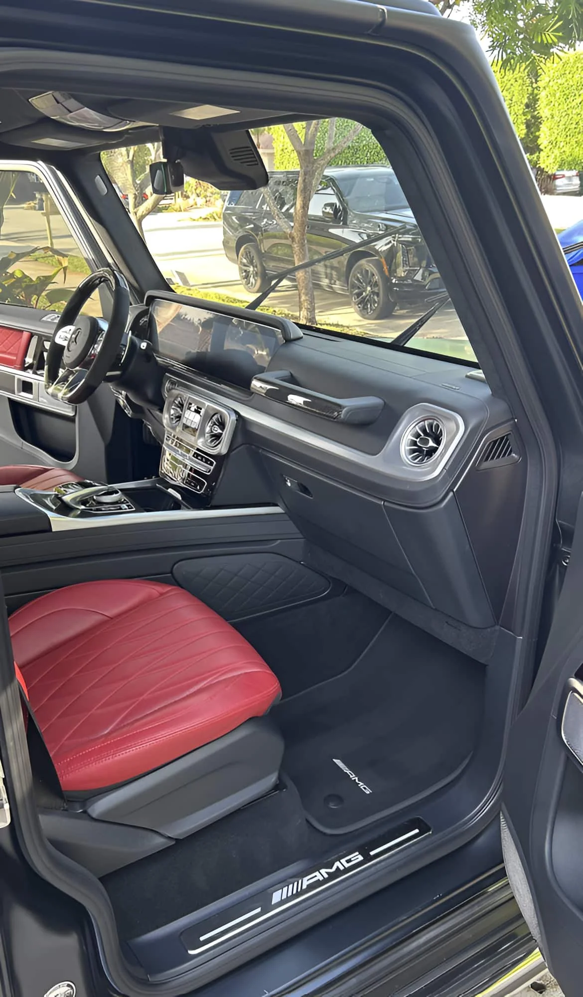 Detailed red AMG leather interior in a Mercedes-AMG G63 by Ale's Mobile Detailing