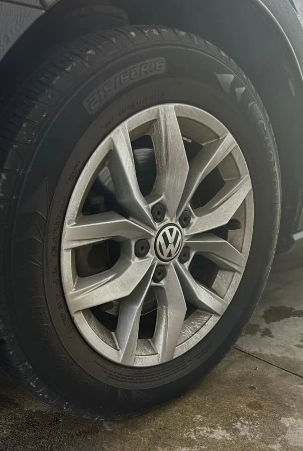 Before wash and wax on wheels of sedan — brake dust build up from years of neglect.