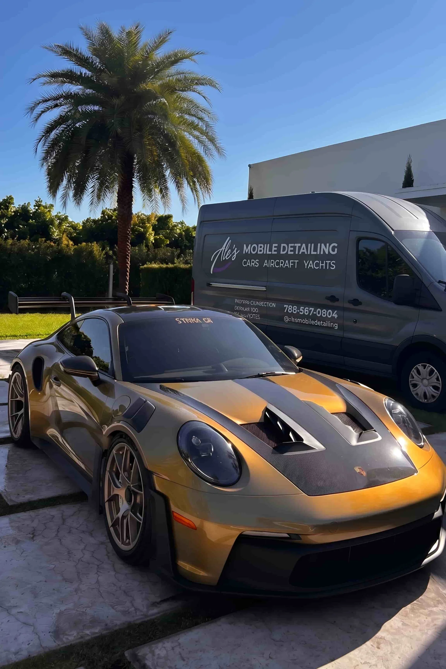 Ale's Mobile Detailing set up beside a vehicle in Miami