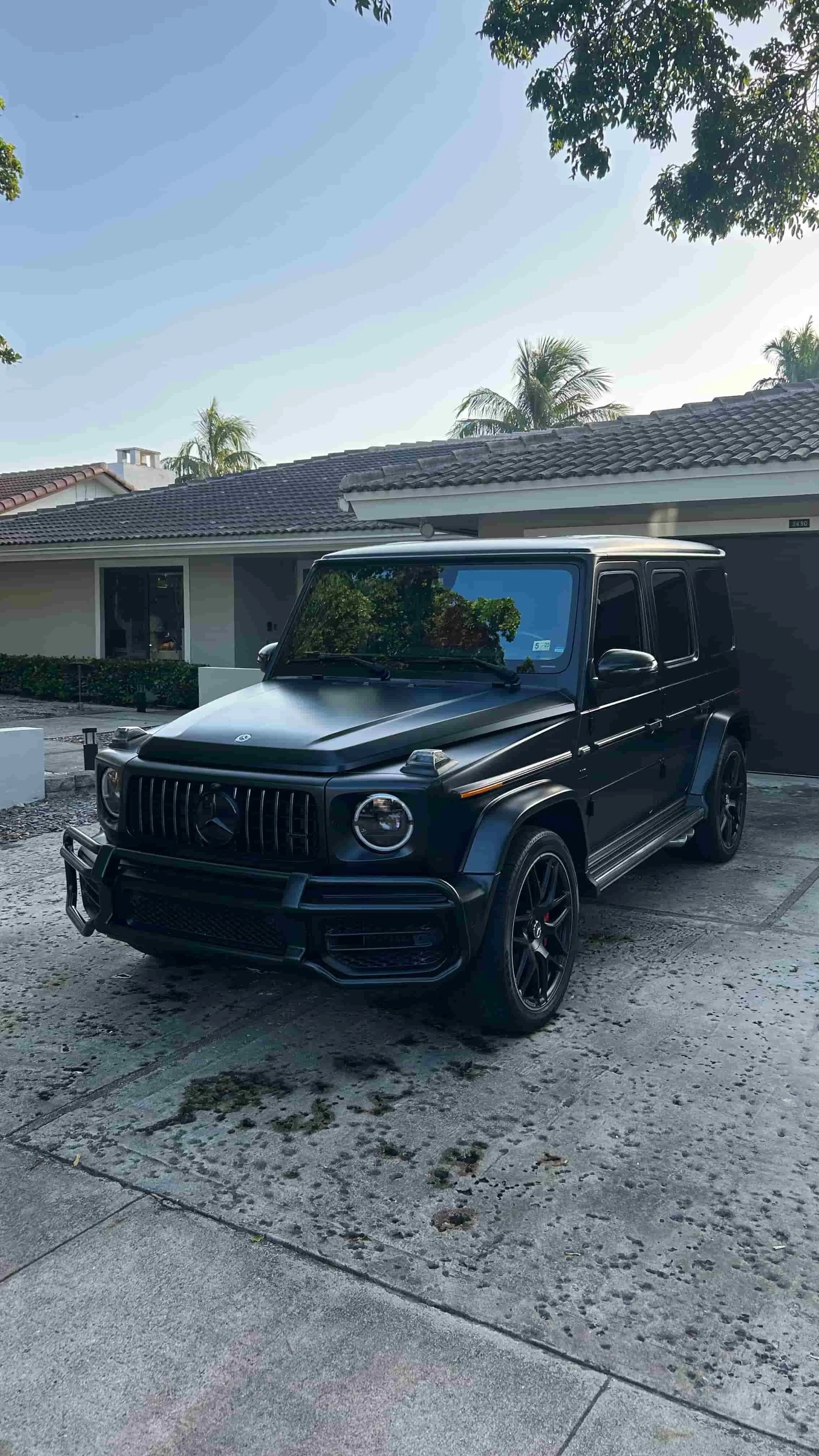 Matte black Mercedes-AMG G63 detailed in a Miami driveway by Ale's Mobile Detailing
