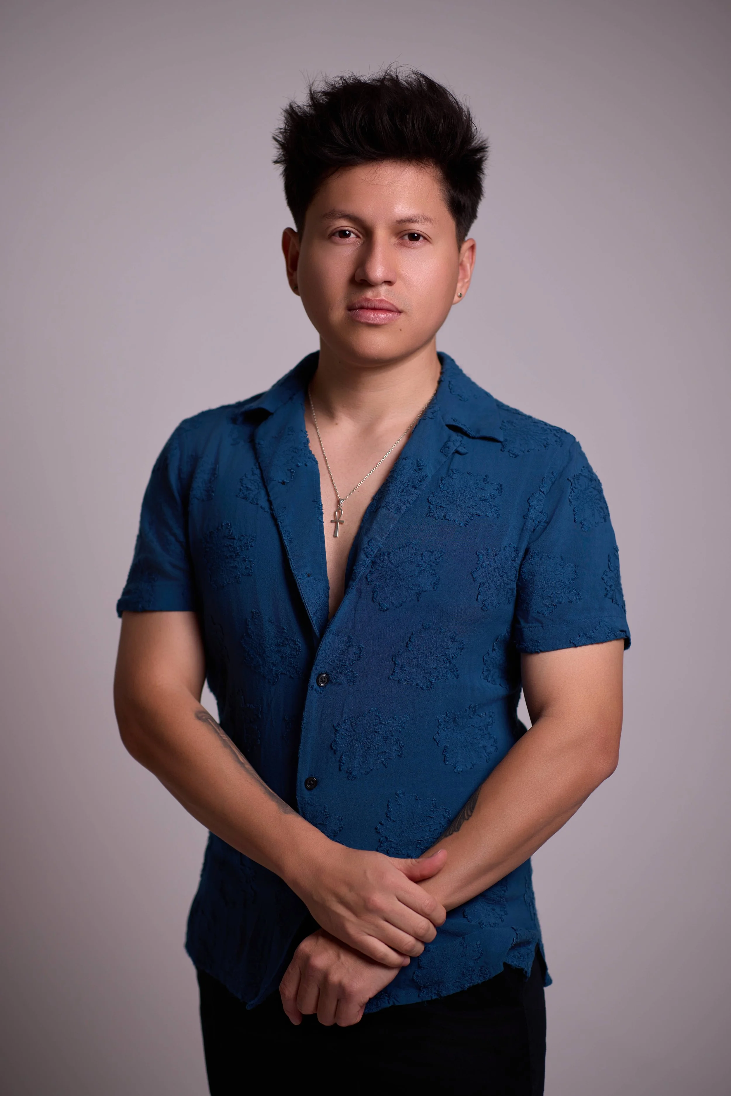 Javier Chancusig in a blue shirt
