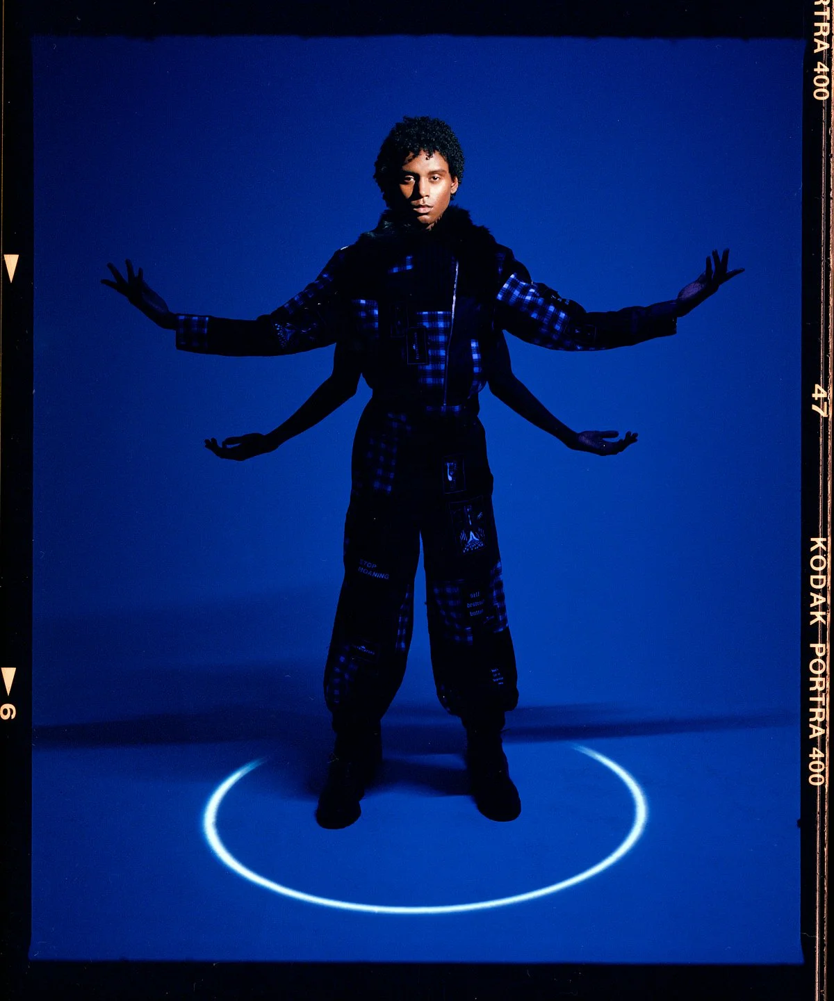 Fashion campaign photography on a saturated blue set